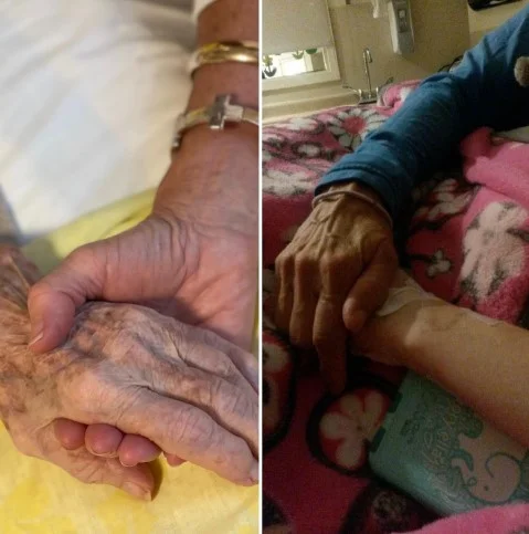 Holding Grammy Babe's hand on the left and the right.