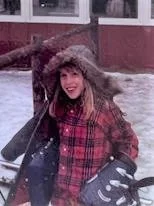 Barb as a girl outside wearing winter coat