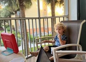 Jack sharing Barb's morning space on the screen porch