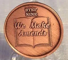 Copper coin with words: STEP NINE We Make Amends