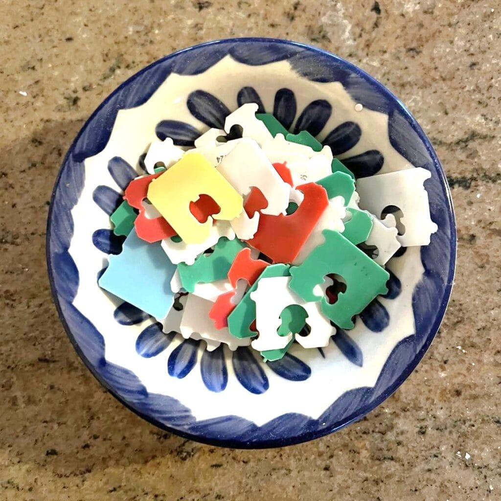 bowl with plastic bread bag fasteners on kitchen counter