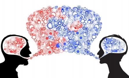 Two silhouetted profiles filled with blue and red bubbles face each other, embodying the adage "Sticks and Stones" as a testament to unbreakable communication or thought exchange.
